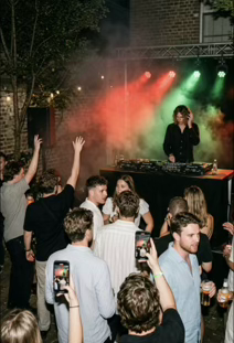 DJ GΛLE event with colorful stage lights and crowd dancing
